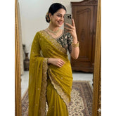 { "alt_text": "Mustard yellow georgette saree with embroidered unstitched blouse, star pattern ethnic wear, 5.5 meter length" }