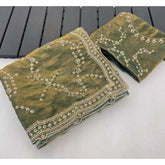 { "alt_text": "Green silk embellished saree with unstitched blouse, 5.5Mtr, traditional Indian ethnic wear" }