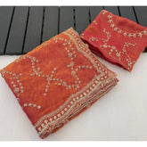 { "alt_text": "Orange silk saree with embellishment, unstitched blouse, 5.5Mtr ethnic wear for women" }