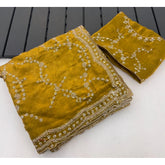 { "alt_text": "Mustard-yellow silk saree with embellishment, unstitched blouse, 5.5Mtr ethnic wear for women" }