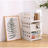 { "alt_text": "White plastic foldable stackable storage organizer for closet organization, easy to store household items" }