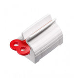 { "alt_text": "Multicolor plastic toothpaste squeezer pack of 2, easy-to-use bathroom hygiene tool" }