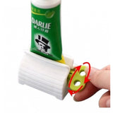{ "alt_text": "Multicolor plastic toothpaste squeezer pack of 2, easy-to-use bathroom hygiene tool" }