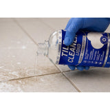 { "alt_text": "Clear liquid tile cleaner bottles, 100 ML, for removing dirt and stains from tile surfaces, fresh fruit fragrance" }