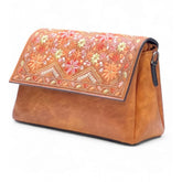 { "alt_text": "Tan polyurethane crossbody sling bag with floral embroidery, adjustable strap, women's fashion accessory" }