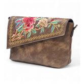 { "alt_text": "Dark brown polyurethane crossbody sling bag with floral embroidery, adjustable strap, women's fashion accessory" }