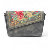 { "alt_text": "Grey polyurethane crossbody sling bag with floral embroidery, adjustable strap, women's fashion accessory" }