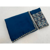 { "alt_text": "Teal chiffon embroidered saree with unstitched blouse, 5.5 meter ethnic wear, Indian fashion" }