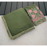 { "alt_text": "Olive green georgette saree with embellishment, unstitched blouse, 5.5 meter ethnic wear for women" }