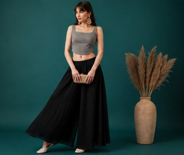 { "alt_text": "Black georgette women's palazzo pants, solid mid-rise wide leg flared pants, ankle length ethnic wear" }