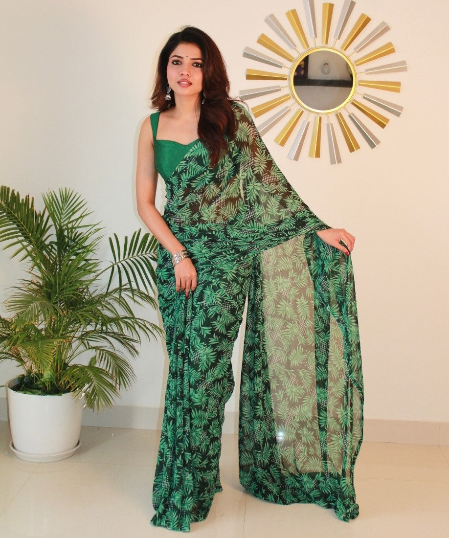 { "alt_text": "Black-green georgette printed saree with unstitched blouse, 5.5m, ethnic wear, Indian fashion" }