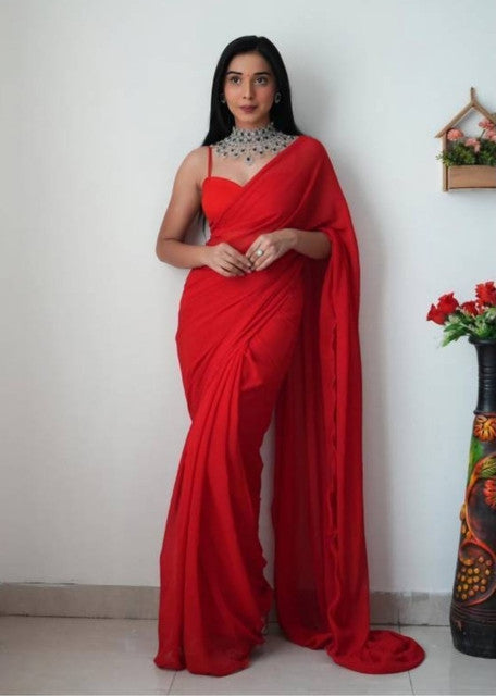 { "alt_text": "Red georgette solid saree with unstitched blouse, 5.5 meter ethnic wear, Indian fashion" }