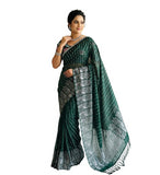 { "alt_text": "Dark green georgette striped saree with unstitched blouse, 5.5 meter ethnic wear, Indian fashion" }