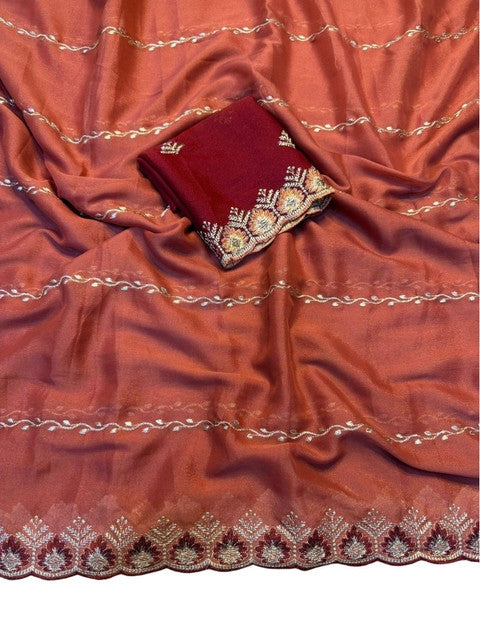 { "alt_text": "Rust orange georgette embroidered saree with unstitched blouse, 5.5 meter ethnic wear, Indian fashion" }