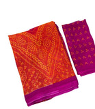 { "alt_text": "Orange-magenta georgette bandhani printed saree, 5.5m, ethnic wear, Indian wedding attire" }
