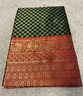 { "alt_text": "Dark green jacquard printed saree with unstitched blouse, 5.5m, ethnic wear, Indian traditional clothing" }