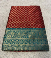 { "alt_text": "Maroon jacquard printed saree with unstitched blouse, 5.5m, ethnic wear, Indian traditional clothing" }