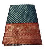 { "alt_text": "Teal jacquard printed saree with unstitched blouse, 5.5m, ethnic wear, Indian traditional clothing" }