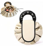 Beige and black polyester makeup organizer bag with large drawstring opening for travel and daily essentials