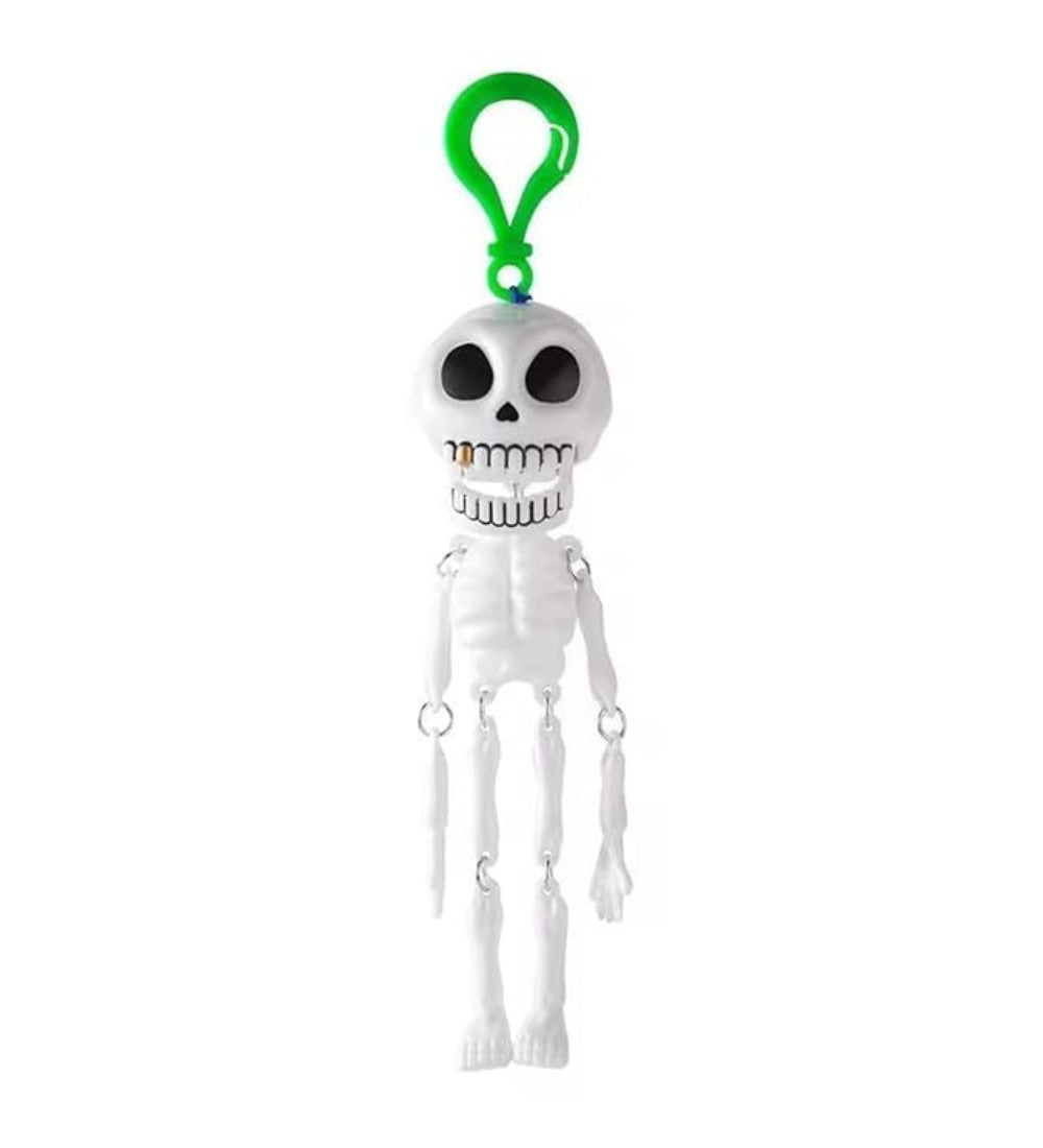 White and green plastic skeleton keychain accessory with detailed skull face for party decor or bag charm