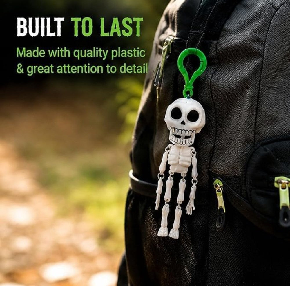White and green plastic skeleton keychain accessory with detailed skull face for party decor or bag charm