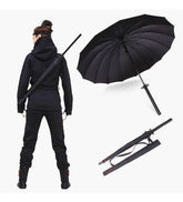 Black metal and plastic katana umbrella designed as a samurai sword for rain protection
