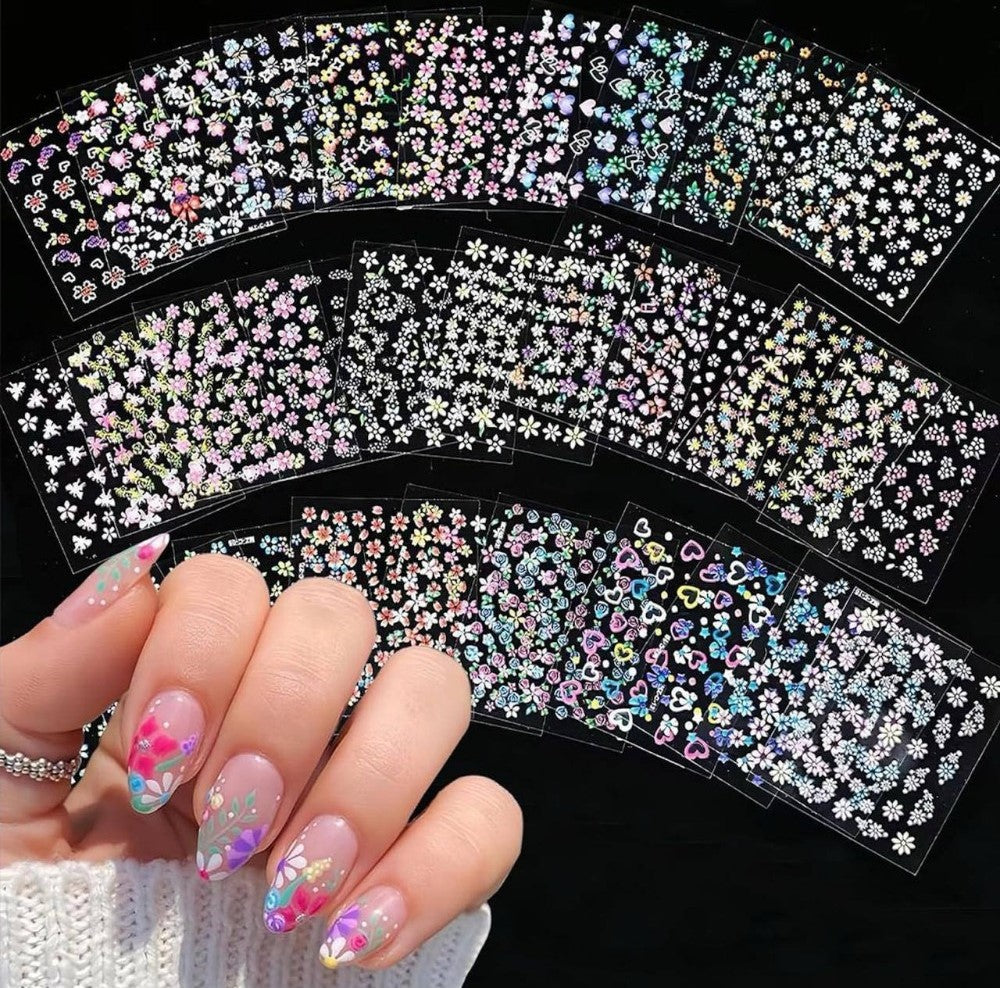 Multicolor self-adhesive nail art stickers featuring floral, daisy, and decorative designs for DIY nail decoration