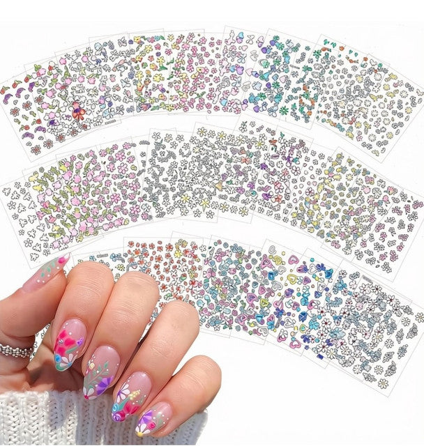 Multicolor self-adhesive nail art stickers featuring floral, daisy, and decorative designs for DIY nail decoration