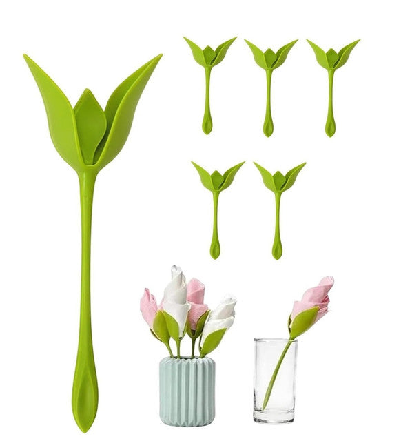 Green plastic napkin holder set designed to display folded paper or cloth napkins in a flower arrangement style