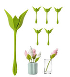 Green plastic napkin holder set designed to display folded paper or cloth napkins in a flower arrangement style
