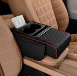 Black and red faux leather car arm rest cushion with memory foam, cup holders, and phone storage compartment