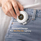 White magnetic selfie light with adjustable brightness and 360-degree swivel for portable video recording