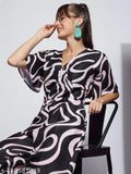 Women's poly blend printed V-neck half-sleeve western jumpsuit in Rama, Pink, Black, or Orange. Durable, wrinkle-resistant fabric with breathability and unique western patterns. Size S to XXL