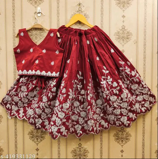 Maroon taffeta silk lehenga, cotton blend choli with short sleeves and embroidered net detail - girls party wear for kids in India