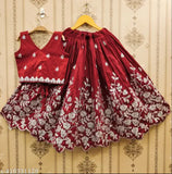 Maroon taffeta silk lehenga, cotton blend choli with short sleeves and embroidered net detail - girls party wear for kids in India