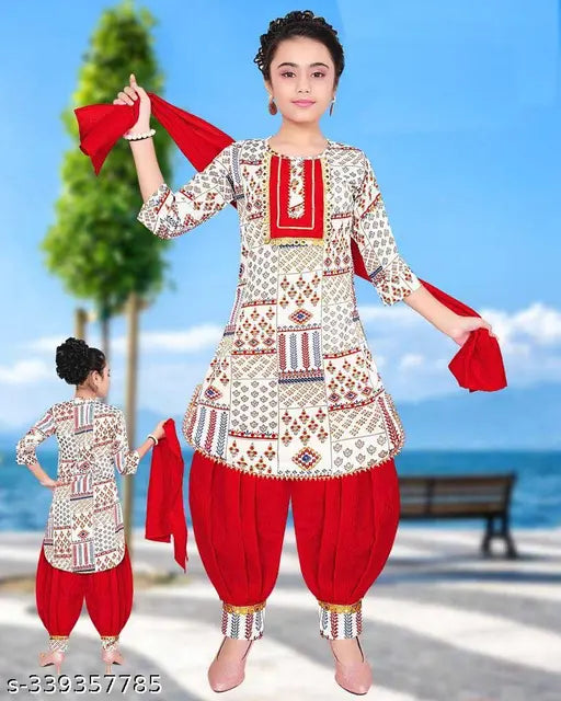 Red cotton blend party/festive designer patiala suit with dupatta for girls, featuring printed anarkali top and patiala bottom. Indian ethnic wear for kids