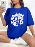 Women's oversized cotton blend print t-shirt in black, featuring the 'STAY WEIRD' graphic design on a half sleeve round neck. Ideal for casual wear