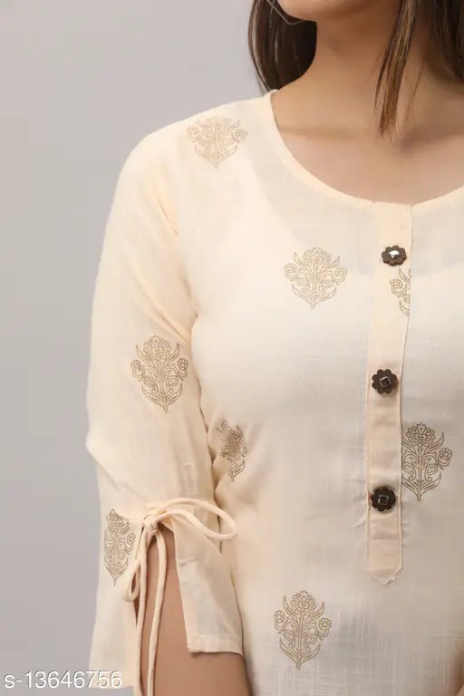 Rayon printed tassel kurta with tiered sharara by MAUKA - Indian-origin women's fashion in golden hues