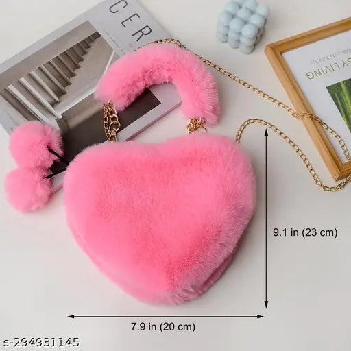 Synthetic heart shape sling bag with pom poms, soft faux fur, and detachable chain strap. Suitable for many occasions and everyday items