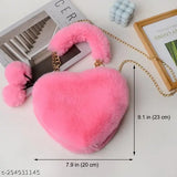 Synthetic heart shape sling bag with pom poms, soft faux fur, and detachable chain strap. Suitable for many occasions and everyday items