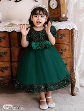 Embellished net green western wear for kids aged 2-9 years, featuring short sleeves. Popular colors for this style include white, pink, baby blue, or lavender. Made in India