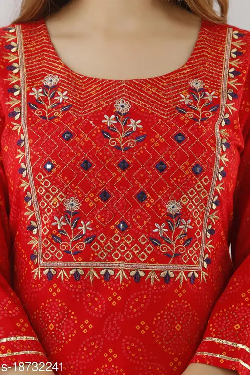 Red rayon embroidered kurta sharara with dupatta by PAAWNI - traditional Indian women's outfit featuring printed net design