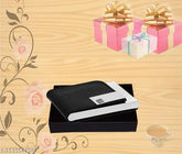 Black leather and stainless steel credit card case, business card holder wallet for men and women. Solid metal accessory on display