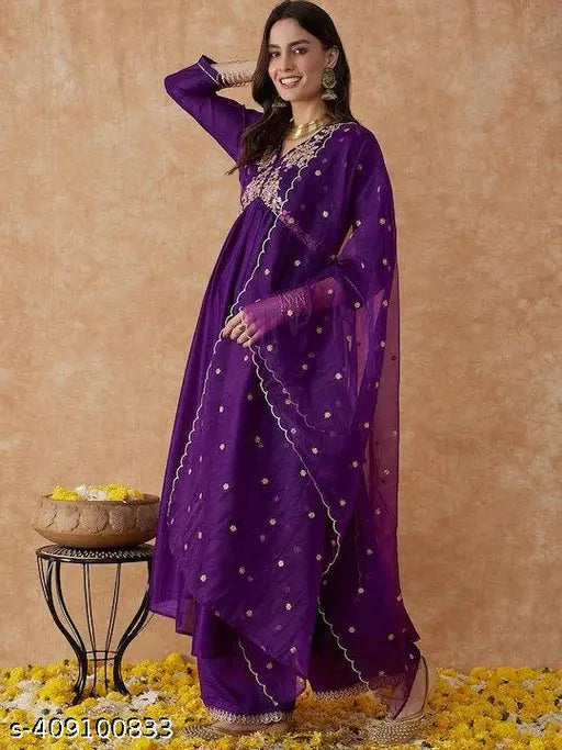 Purple vichitra silk A-Line kurta with palazzos and dupatta, embroidered thread work detail. Traditional Indian fashion for women's ceremonies, parties, or festive celebrations