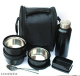 Stainless steel microwave safe lunch box set, includes 3 inner steel containers (400ml each), 1 steel bottle (750ml), pickle dibba, spoon, fork, and bag (black). Leak-proof, BPA-free lids. Insulated, adjustable shoulder straps, airtight, freezer safe, dishwasher safe. Indian origin