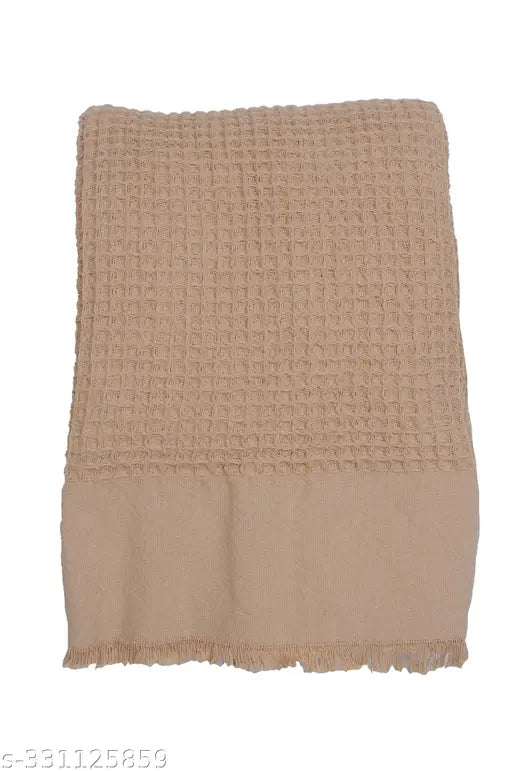 Washed waffle biege cotton blanket throw with fringes, perfect for cozy home decor