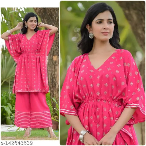 Attractive trendy rayon gold printed kaftan set with palazzos, three-quarter sleeves, party wear for women" (123 characters)