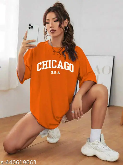 Trendy cotton blend printed oversized t-shirt for women and girls, featuring short sleeves and vibrant pattern. Available in sizes XS to XL