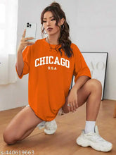 Trendy cotton blend printed oversized t-shirt for women and girls, featuring short sleeves and vibrant pattern. Available in sizes XS to XL