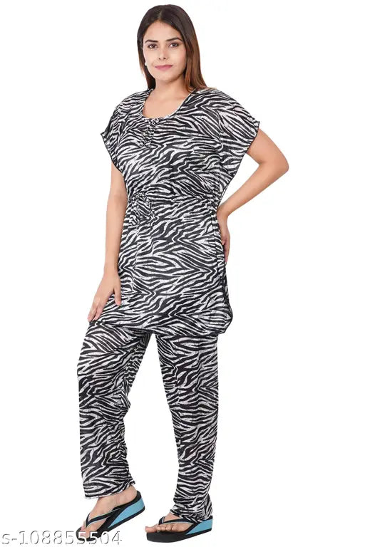 Printed kaftan-style satin night suit, ideal for sleepwear and loungewear in sizes L (42in bust, 30in length, 46in waist, 40in length) and XL (44in bust, 30in length, 48in waist, 40in length). Made from soft satin fabric with elastic and drawstring waist. Origin: India